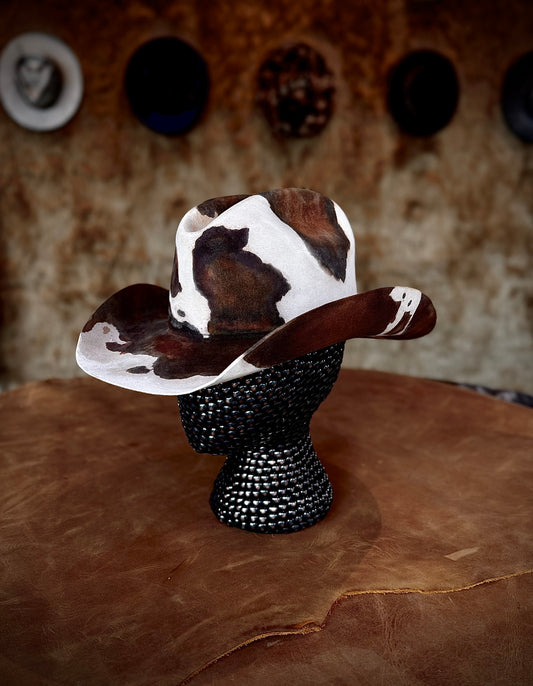 CowHide Crown limited-edition cowhide hat shown from a second angle on a black textured mannequin