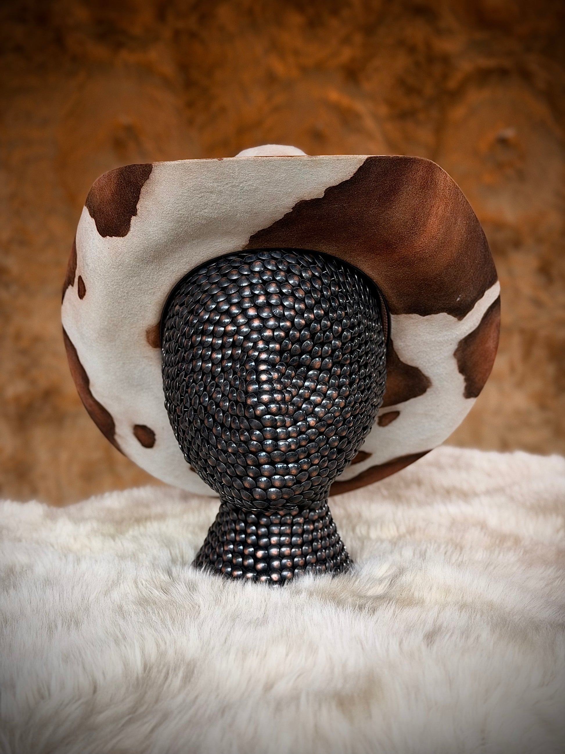 Back view of the CowHide Crown cow print cowboy hat by TROVADOR